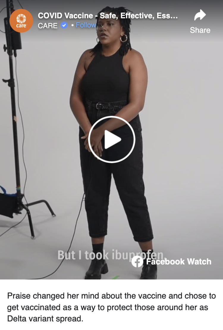 Black woman standing in a room with a camera and lights